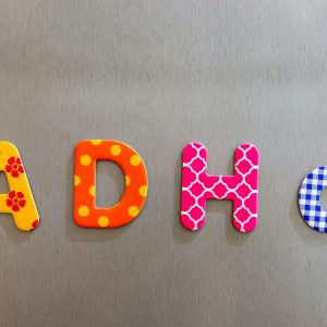 Closeup shot of colorful words spelling adhd