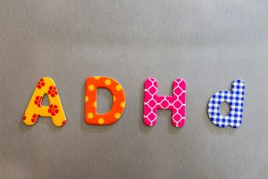 Closeup shot of colorful words spelling adhd